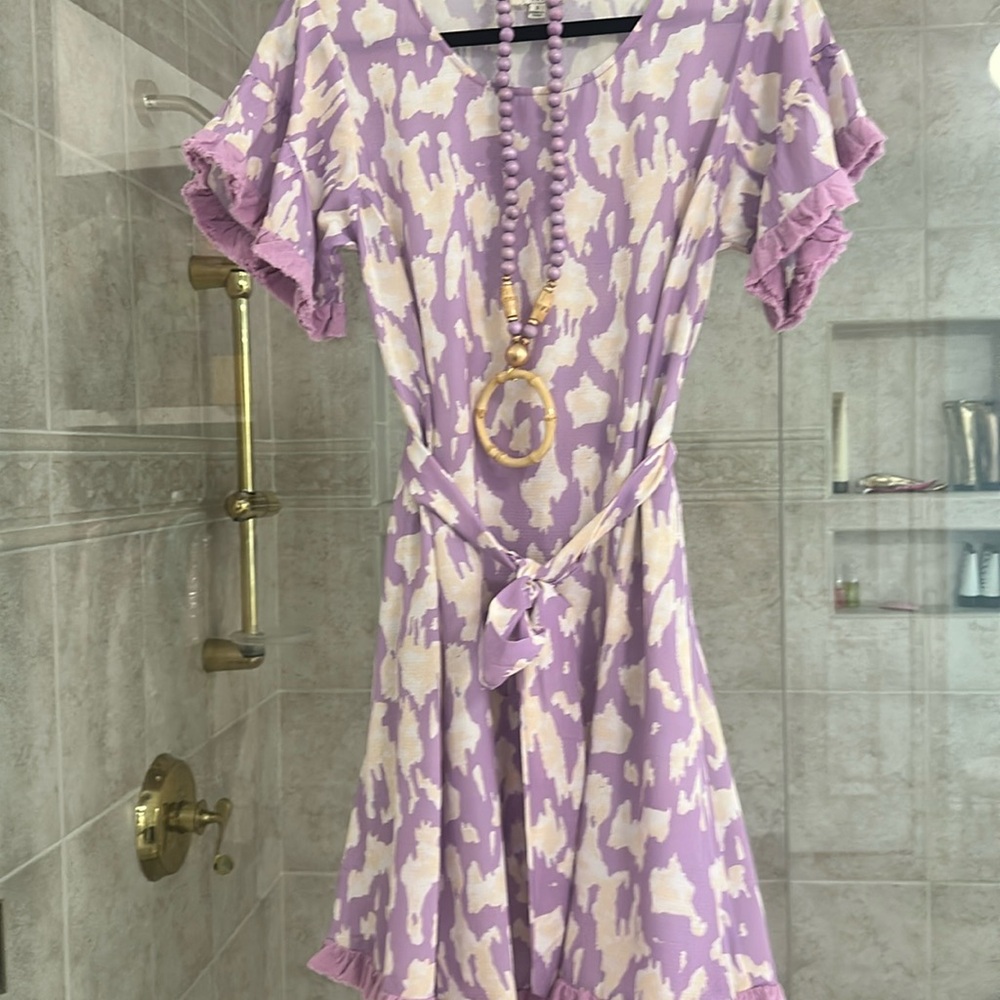 Purple,crème and white knee lenght or mini dress.  Never worn.  Necklaces goes